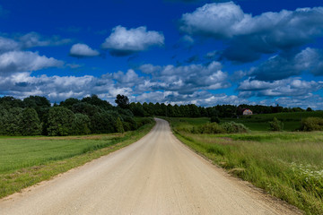 Wall Mural - Gravel road in latvian countryside.