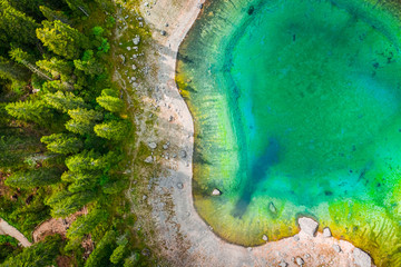 Wall Mural - top down view to mountain lake carezza in dolomites, italy