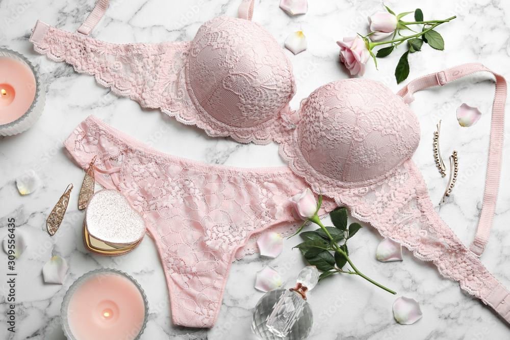 Flat lay composition with women's underwear on marble background - obrazy, fototapety, plakaty 