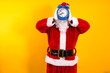 © tetxu - Santa Claus holding the alarm clock in front of his face. Christmas greeting