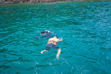 Fototapeta Do akwarium - Man snorkeling in a sea