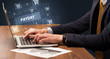 © ra2 studio - Businessman working on laptop with PAYDAY inscription, online shopping concept