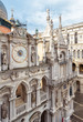 Doge`s Palace or Palazzo Ducale, Venice, Italy. It is famous landmark of Venice. Nice ornate facade of old Doge`s Palace with statues and clock.