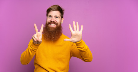 Redhead man with long beard over isolated purple background counting seven with fingers