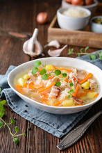Kapusniak, Classic Polish Soup Made From Sauerkraut, Pork Ribs, Smoked Bacon, Potato, Carrot And Other Vegetable