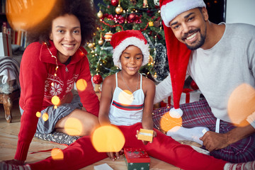 Sticker - Happy family with girl at winter holiday season