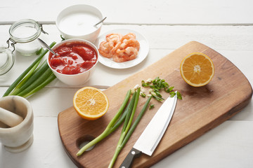 preparing food on white, rustic wooden table