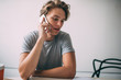 © GalakticDreamer - Handsome hipster guy calling to operator for checking account balance sitting at coffee shop and using 4g wireless internet, Caucasian male in casual wear phoning via smartphone application