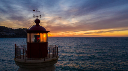 lighthouse at sunset, in the port of Andratx, Majorca Spain