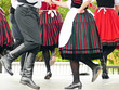 © Zoltan - Hungarian folk dancers dancing in black, white and red in a traditional festival