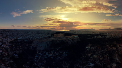 Wall Mural - Aerial drone video of illuminated Acropolis hill and Masterpiece Parthenon with beautiful colours at dusk, Athens, Attica, Greece