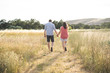 © Jordan - Couple walking in the dry grass