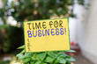 © A - Writing note showing Time For Business. Business concept for fulfil transactions within period promised to client Plain paper attached to stick and placed in the grassy land