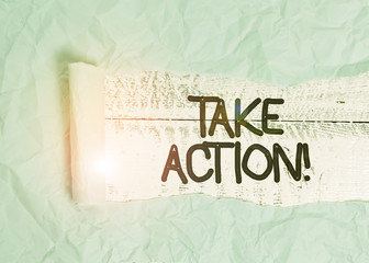 Poster - Text sign showing Take Action. Business photo text do something official or concerted to achieve aim with problem Cardboard which is torn in the middle placed above a wooden classic table