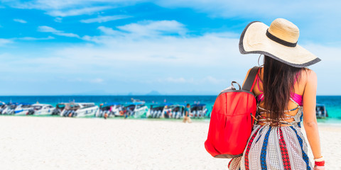 Wall Mural - Traveler woman in summer dress with backpack joy relaxing on white sand beach, Bamboo island, Andaman sea, Krabi, near Phuket, Travel Thailand, Beautiful destination Asia, Summer holiday vacation trip