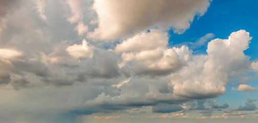 Wall Mural - Blue sky background with white dramatic clouds