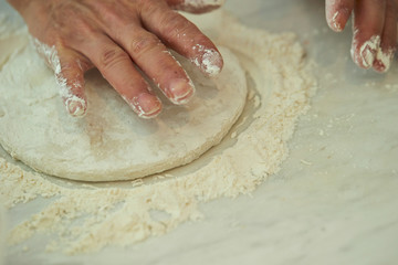 Wall Mural - Kneading bread dough by hands