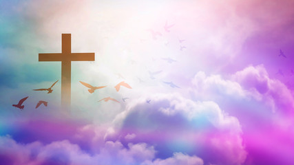 Wall Mural - christian cross appeared bright in the sky with soft fluffy clouds, white, beautiful colors. with th
