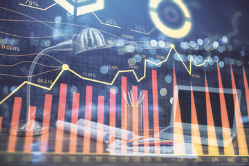 Stock market chart hologram drawn on personal computer background. Multi exposure. Concept of investment.