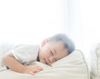© MIA Studio - Toddler boy sleeping in sofa and dream.Asian 2 years old baby boy sleep on the sofa in living room.Sleep time,Comfortable, peaceful and growth hormone concept.