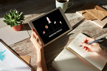 Marketing strategy diagram on device screen. Business concept.