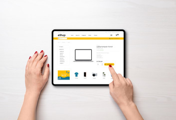 Wall Mural - Shopping online with tablet. Modern online shop with grab deals banner on desk. Top view, falt lay