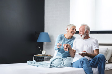 Elderly couple taking medication