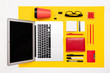 © Ivan Traimak - School and office supplies lie neatly on a yellow background