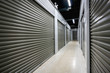 Long storage facility corrodor. Garage doors with light