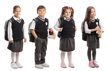 Canvas Print - Group of pupils with backpacks wearing a school uniform