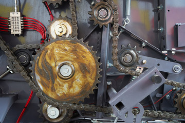 the drive chain and sprockets coated with lubricant.