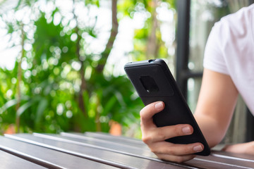 Asian woman hand using smartphone to contact with email, message, chatting online or shopping, customer service or technology concept