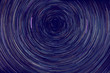 star trails -  light streaks of stars around Polaris in the night sky due to Earth's rotation