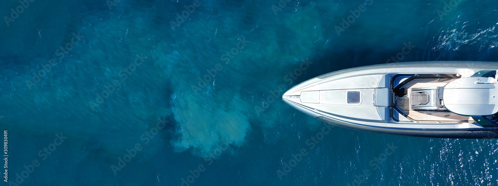 Aerial drone ultra wide top down photo of luxury rigid inflatable speed boat cruising in high speed in Aegean deep blue sea, Greece - obrazy, fototapety, plakaty 