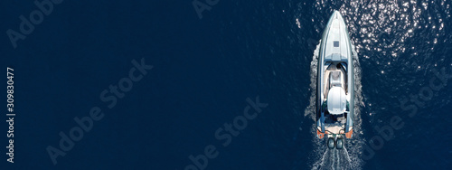 Fotografía Aerial drone ultra wide top down photo of luxury rigid inflatable speed boat in