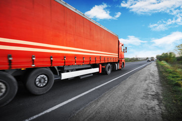 Sticker - Truck with a trailer on the countryside road against a sky with clouds