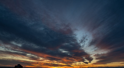 Sunset or Sunrise sky with orange and yellow colors. With beautiful clouds, perfect for sky replacement.