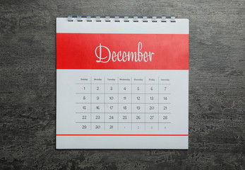 Wall Mural - December calendar on grey stone background, top view