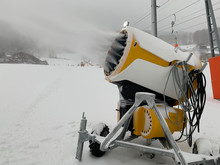 A Snow Cannon Snow-covers A Ski Slope With Snow