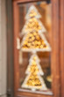 Abstract blur. Street in a Christmas day in an old European town. Lamps garlands, christmas decor and decorations. The decoration of the shop window or restaurant.