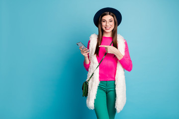 Poster - Portrait of her she nice attractive cheerful cheery girl using a5 app device recommending fast speed isolated on bright vivid shine vibrant green blue turquoise color background