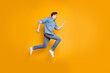 © deagreez - Side profile photo of cheerful positive man screaming after seeing sales beginning isolated in white footwear over vivid color background