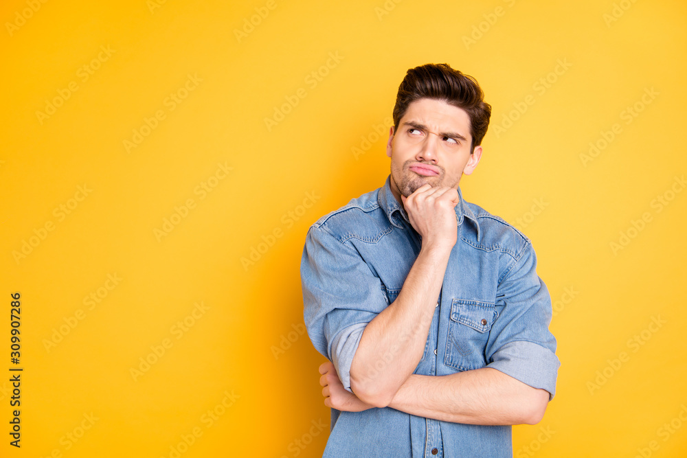 Photo of bewildered funny cute evil man pondering over his future plans looking into empty space isolated vivid color background - obrazy, fototapety, plakaty 