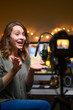 © Anton - The video is a blogger, leads a YouTube channel, emotionally talks to the camera with a professional light, and a studio microphone.