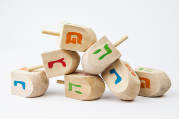 Wooden toy for Hanukkah on white background