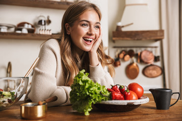 Sticker - Image of joyful caucasian woman laughing while cooking dinner