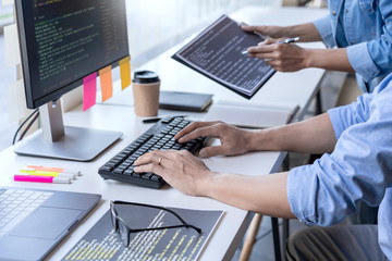 Wall Mural - pensive programmer working on on desktop pc programming code technologies or website design at offic