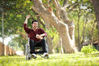 © chayathon2000 - Asian Young Man sitting on the wheelchair in the park hospital