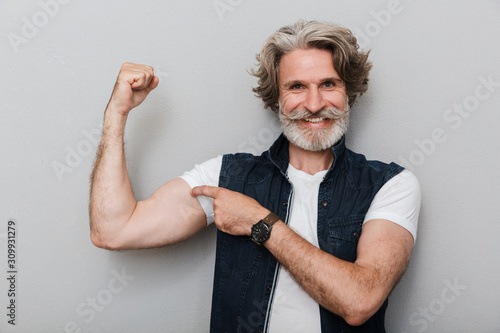Fotomural Portrait of a handsome stylish mature man wearing a vest