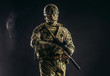© alfa27 - brave strong and confident man soldier wearing army clothes, green camouflage stand holding gun, ready to shoot